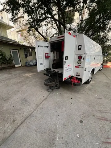 Magnet Plumbing service vehicle on-site for Slab Leak Repair in Downtown Austin